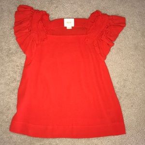 Orange Anthro Maeve Top with ruffled cap sleeve